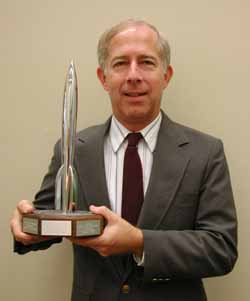 Melvin Schuetz the archivist for the Chesley Bonestell collection with the Hugo award he received for his work on The Art of Chesley Bonestell.  Click on his picture to go to the Chesley Bonestell archives.